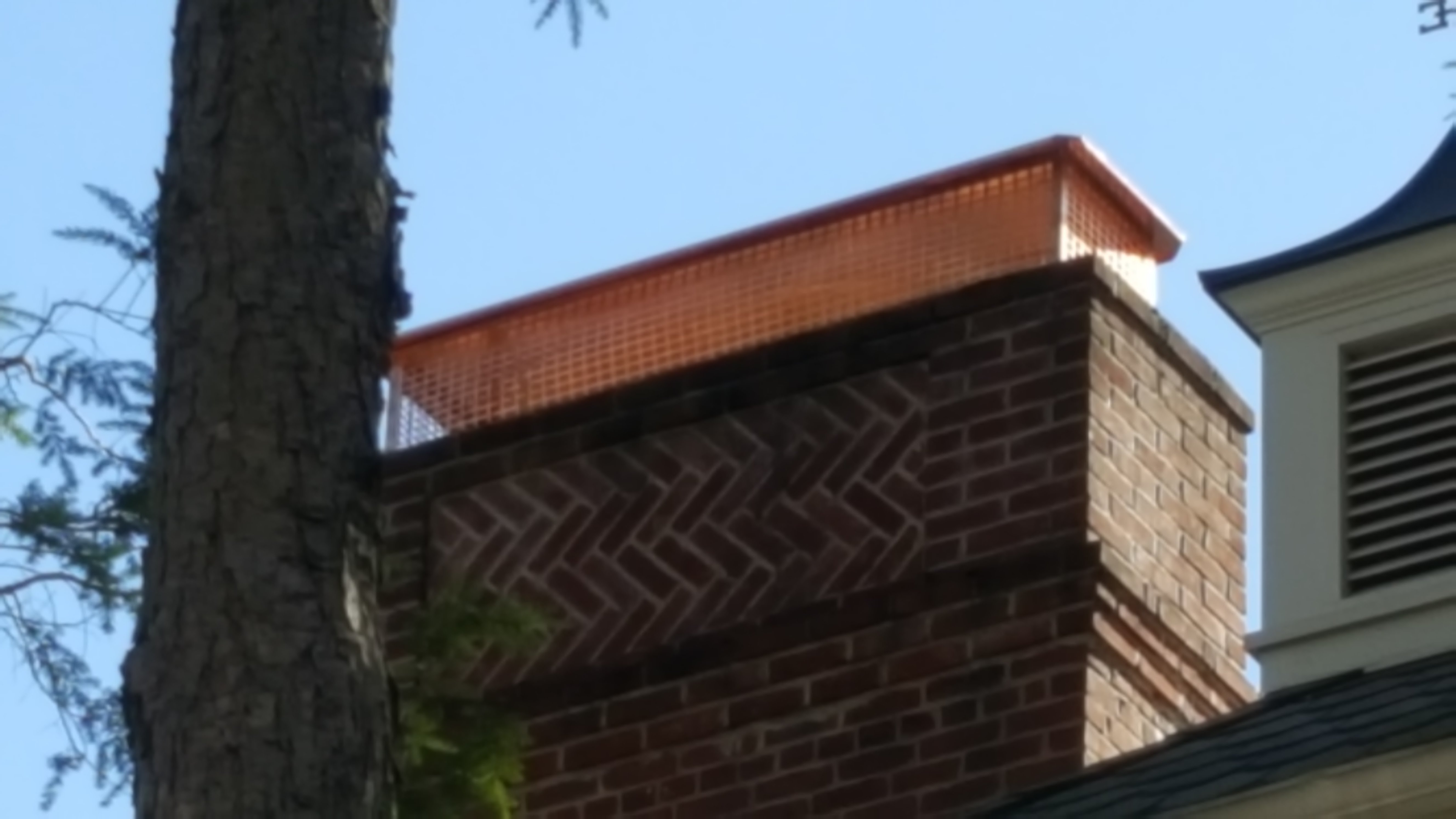 New stainless steel chimney cap installed in East Islip, NY