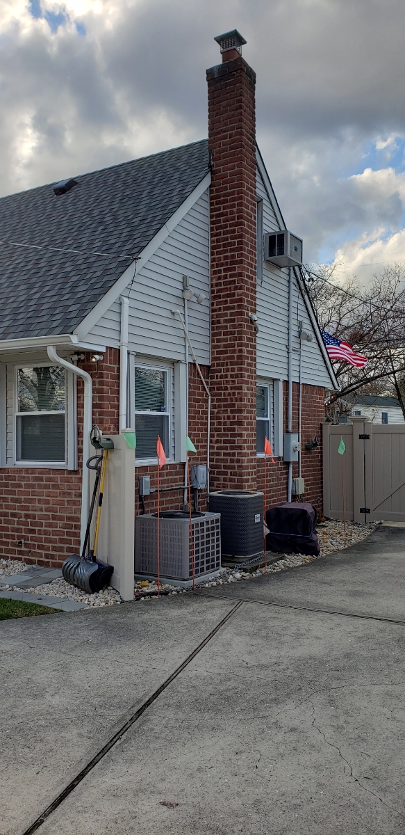 Professional chimney repointing restoring brick joints in East Islip, NY