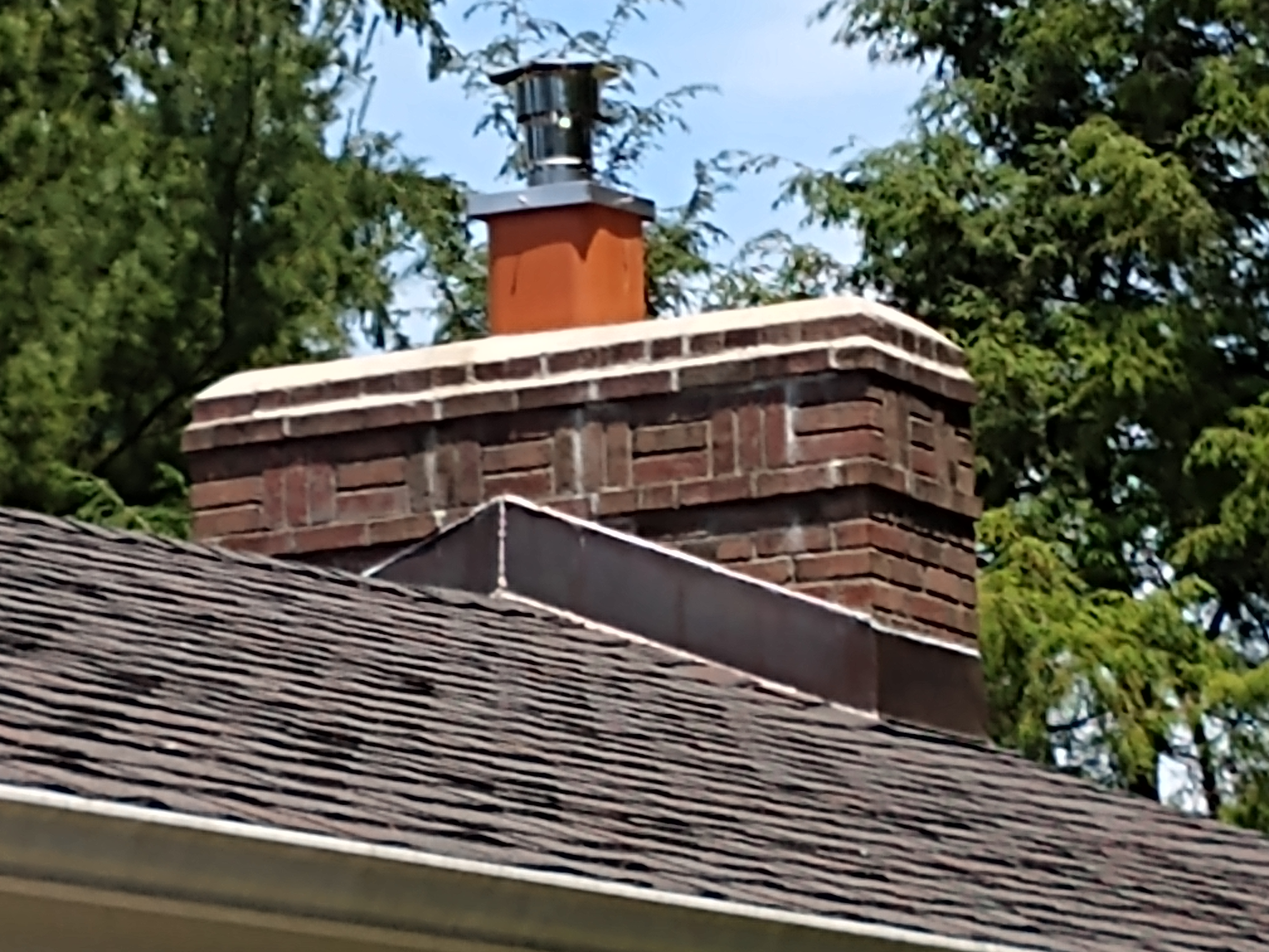 Stainless steel chimney cap with animal guard in East Islip, New York
